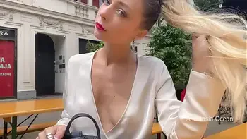 Flashing boobs in public. Topless right in the middle of a busy street.