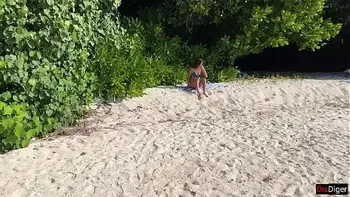 Pissed on girl on a public beach - She was shocked