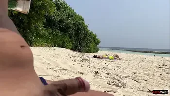 Pervert cummed on girls while they were sunbathing on a public beach