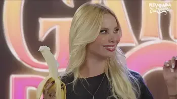 Hot girls, with a banana in their mouths, in a sucking challenge, who has the deepest throat?