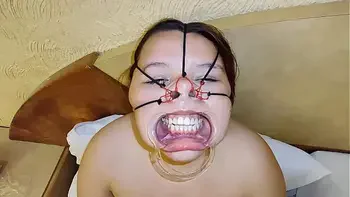 She loves the cock and balls on her bondage face