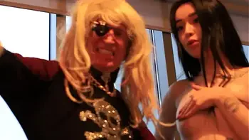 Clothed man and naked women