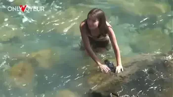 Beach Voyeur. Horny teen babe rides her boyfriend on the beach