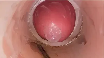 The camera in the deep pussy records a huge ejaculation of sperm into the condom