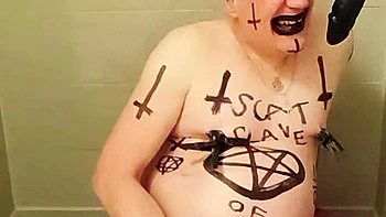 Satan slave takes an enema on Satan's orders