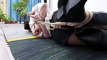 Asian Girl In Boots Hogtied And Poletied