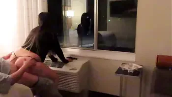 Having fun wearing a see through short dress in hotel public areas