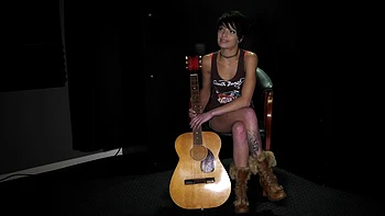 The backstage of a tattooed brunette girl, Kodi Jett, during filming