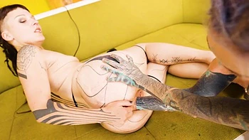 Anuskatzz in wild lesbian fisting action with her bald, tattooed, pierced partner