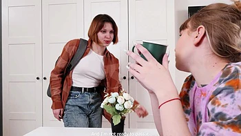 Redhead and blonde teen finger each other’s shaved pussies in a steamy lesbian scene.