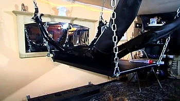 Humiliating chaining body stretching in latex dress