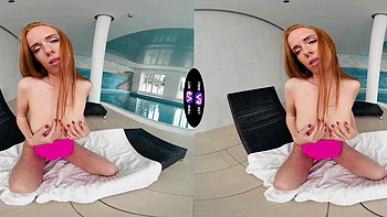 A cute and sweet red-haired girl named Holly Molly plays with her pussy.