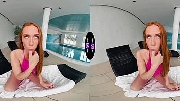 Redhead beauty Holly Molly wanking her pussy in the kitchen