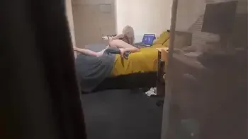 Girl caught masturbating through the window