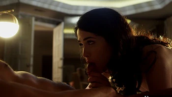 Two guys share a hot interracial threesome with a stunning brunette on the bed