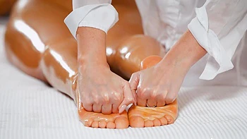 Kaisa Nord and Marchy Rock in sensual lesbian massage with oily pussy fingering.