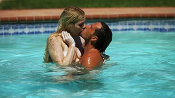 Two cute girls are having fun with boys in the pool, enjoying every moment.