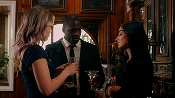 Two cute girls share a big black cock in an intense scene.