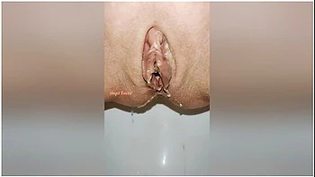 Beautiful Bald Pussy Of Petite Milf Makes The Big Powerful Urine Fountain Close Up