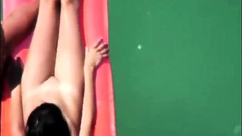My nudist niece Emma floating in the sea (voyeur)