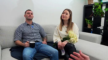 Two hot babes, amalia and peaches, share a guy’s cock on the sofa.