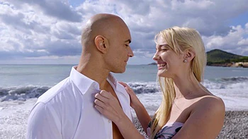 Dirty Christian and Kenna frolic on the sandy shore