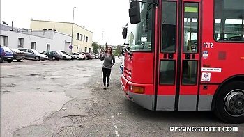 Crazy solo pissing on the pave with a hot short-haired girlfriend Suzie